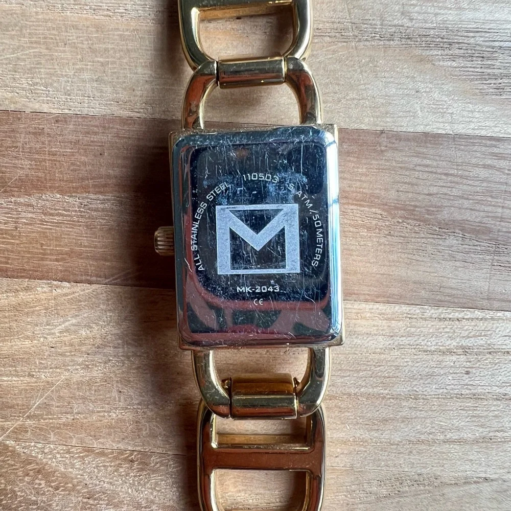 Michael Kors ladies rectangular gold tone bracelet dress watch NEW BATTERY